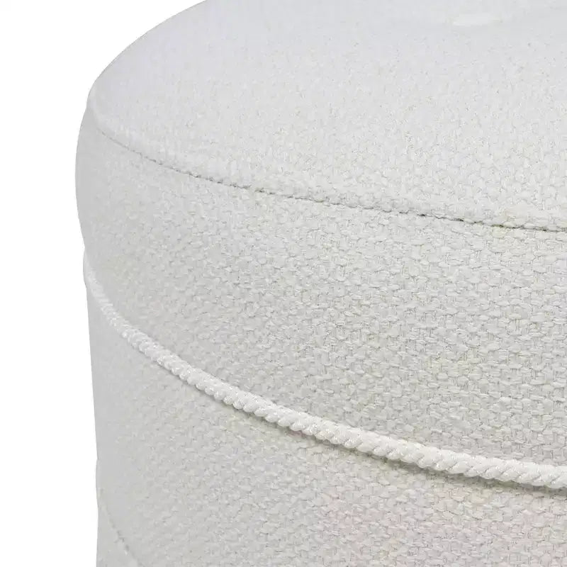 Ottoman rond d'appoint capitonné