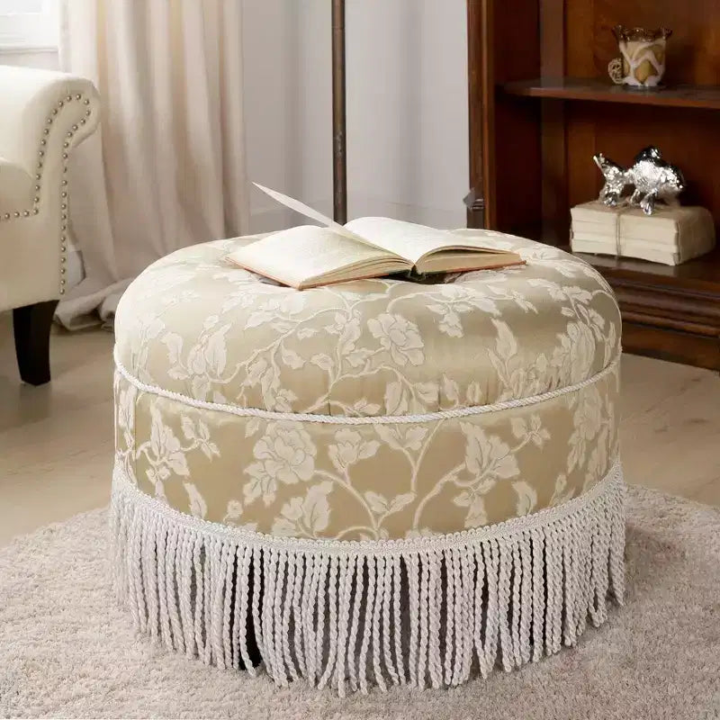 Ottoman rond d'appoint capitonné