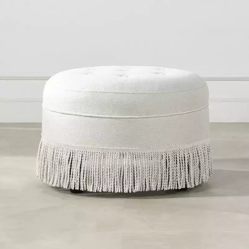 Ottoman rond d'appoint capitonné