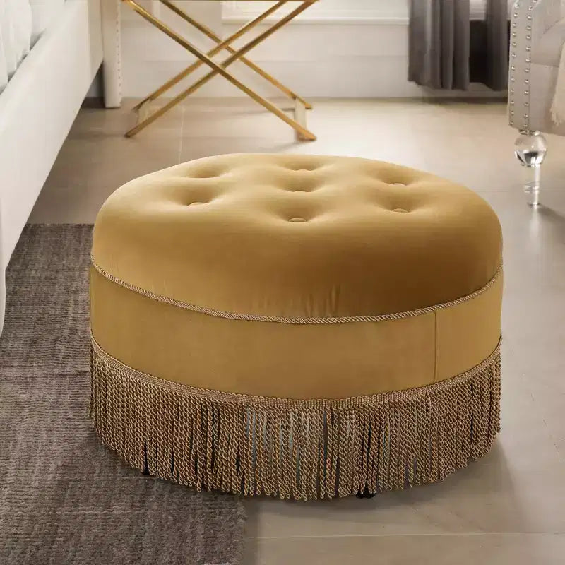 Ottoman rond d'appoint capitonné